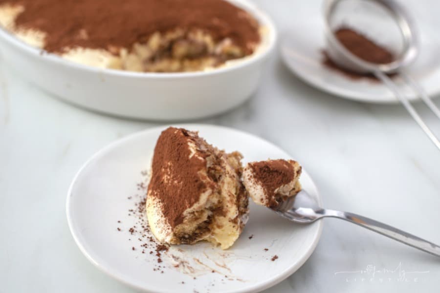 slice of Italian Tiramisu on a white plate