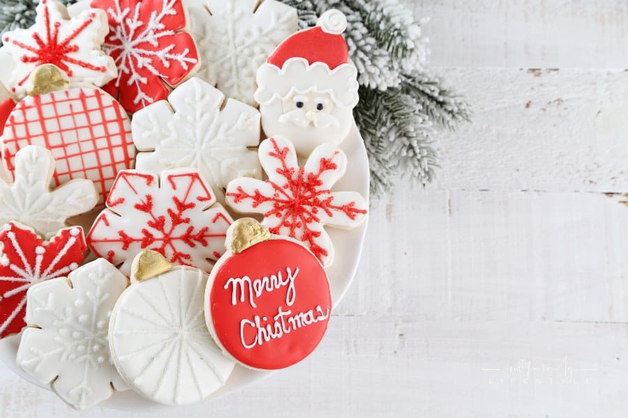 decorated Christmas cookies on a white plate