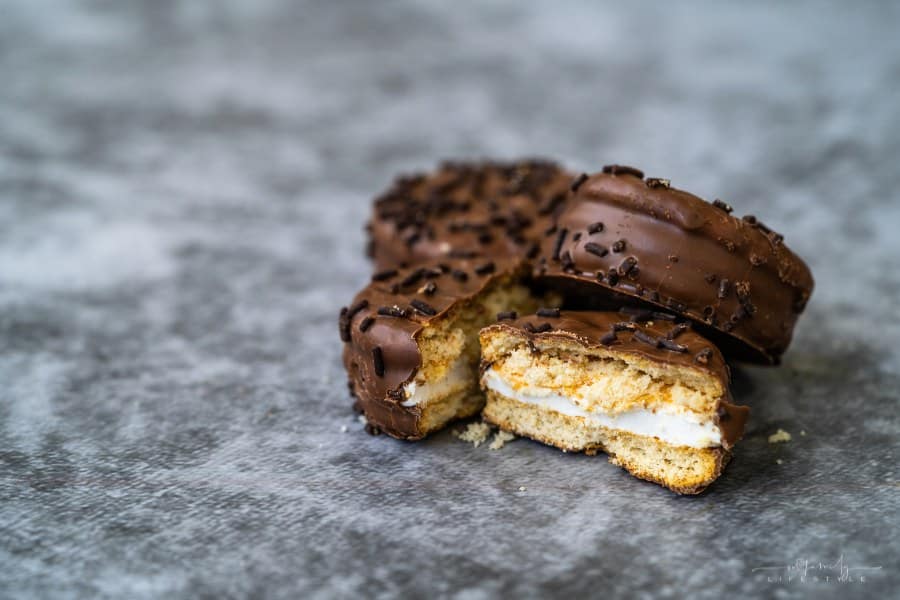 homemade moon pie cookies covered in chocolate sprinkles cut open