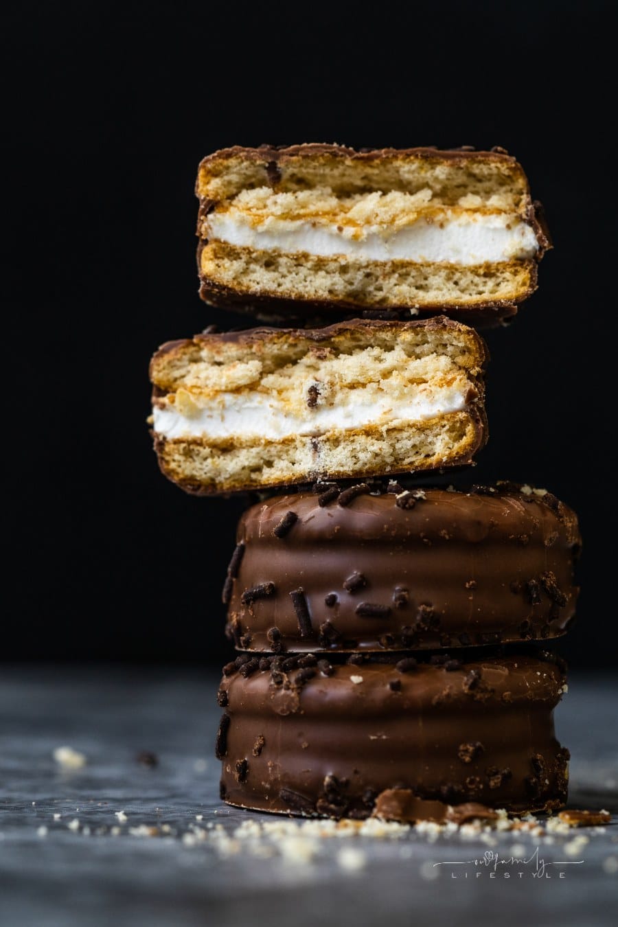 homemade moon pie cookies covered in chocolate sprinkles and stacked