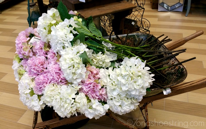 Nebraska Furniture flowers in wheelbarrow