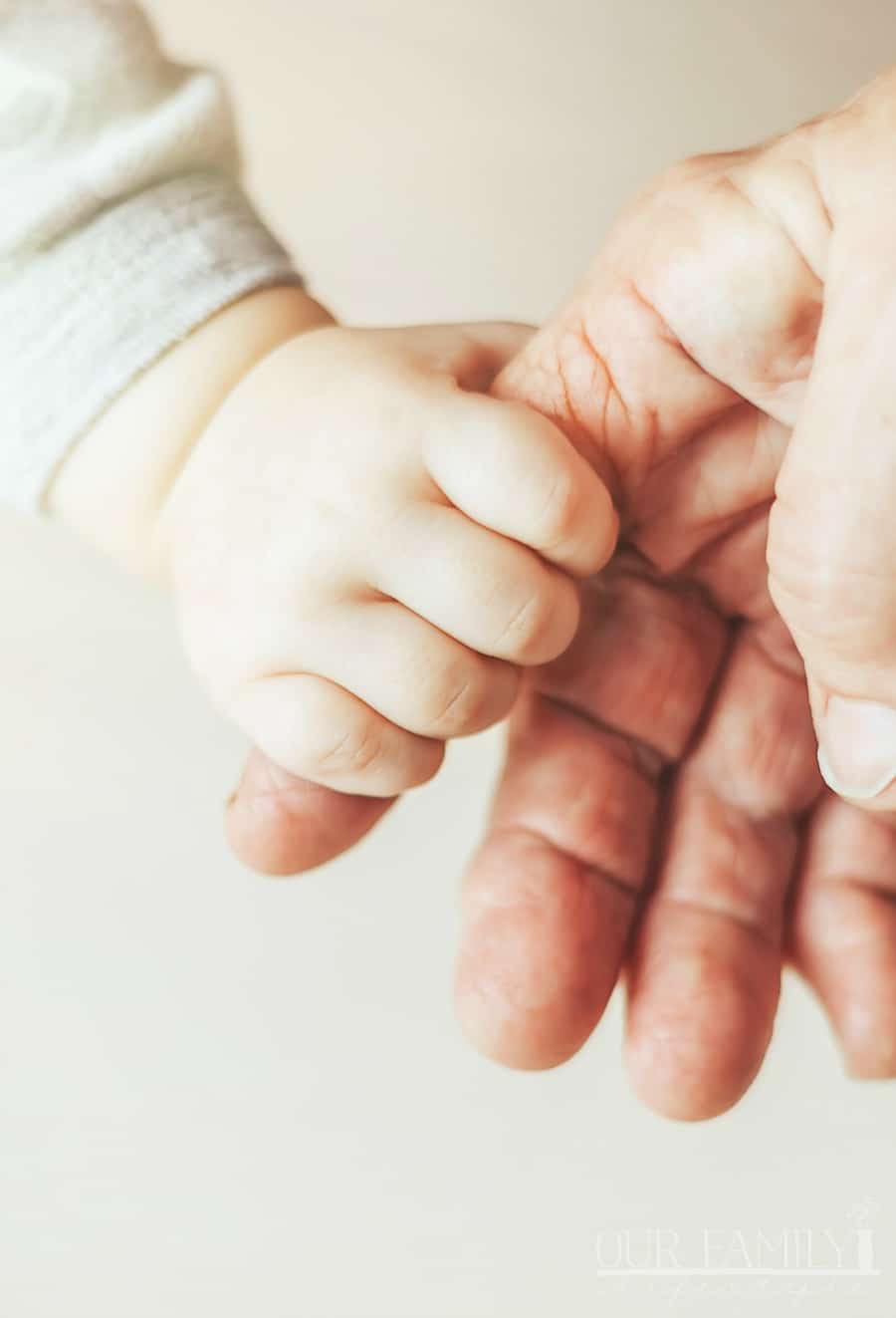 baby and grandmother hand