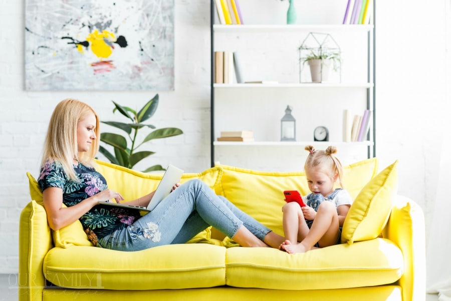 working mom on couch with child