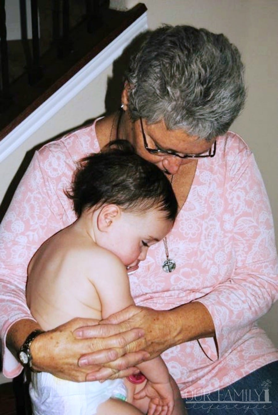 mom holding baby Joeli