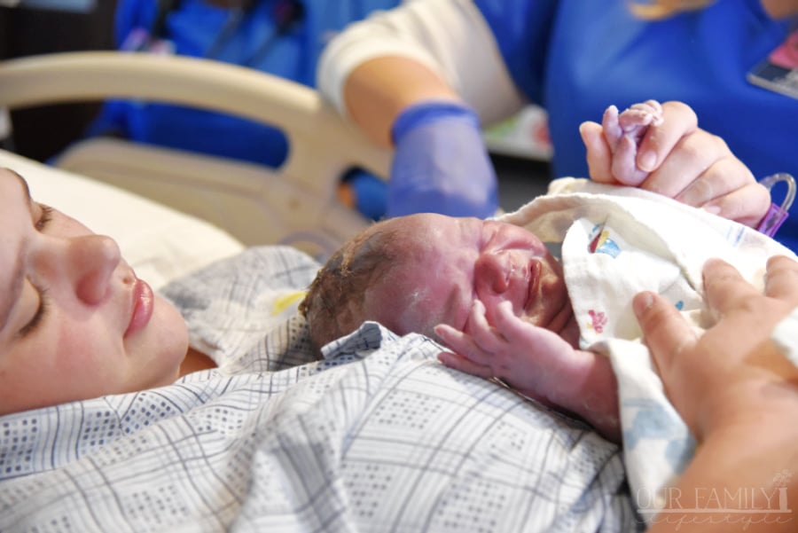 newborn baby placed on mom after birth